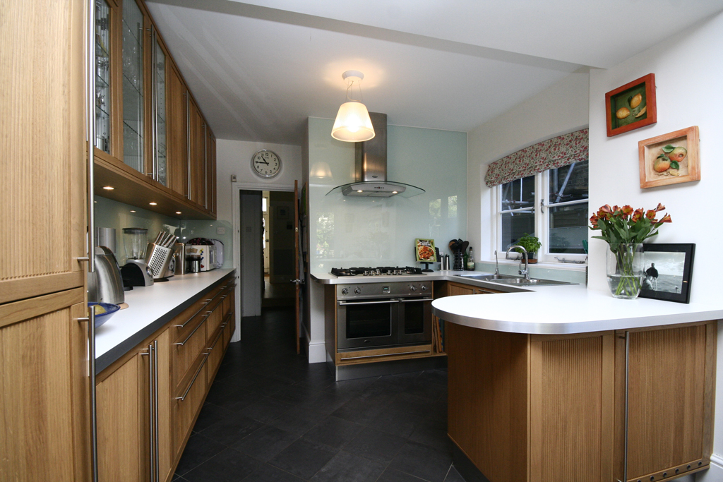 luxury kitchen with full height solid glass splashback
